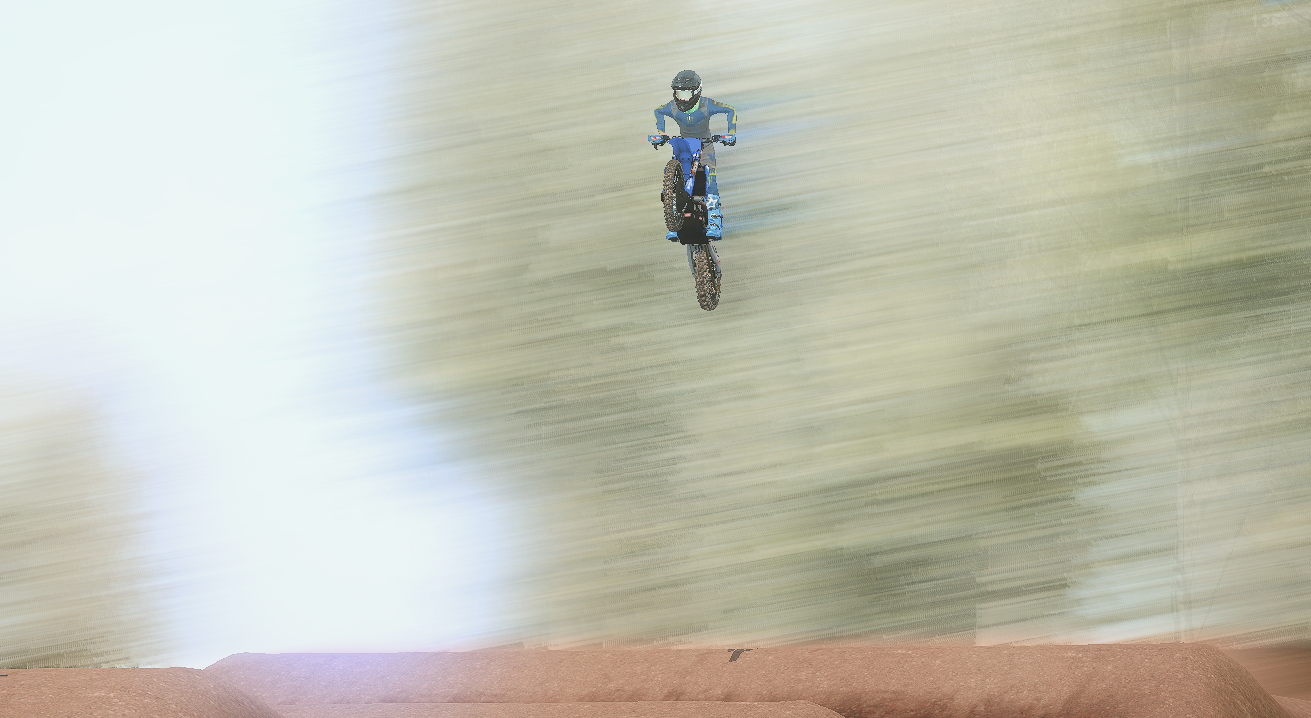 MX Bikes rider approaching a dirt jump